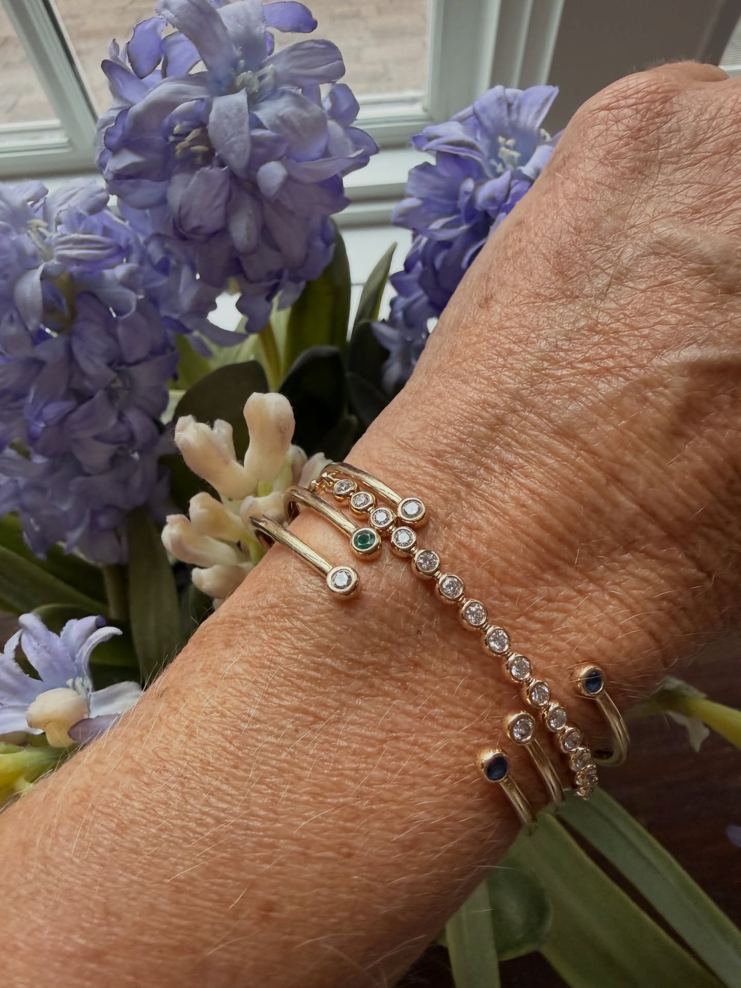 Beautiful stack! 💜 A gorgeous bezel set diamond bracelet nestled with three of our double stone cuffs. 

The bezel set diamond bracelets are amazing 🩷🩷🩷🩷 Diamonds across the top of the wrist with a strong engravable gold bar across the back. Add