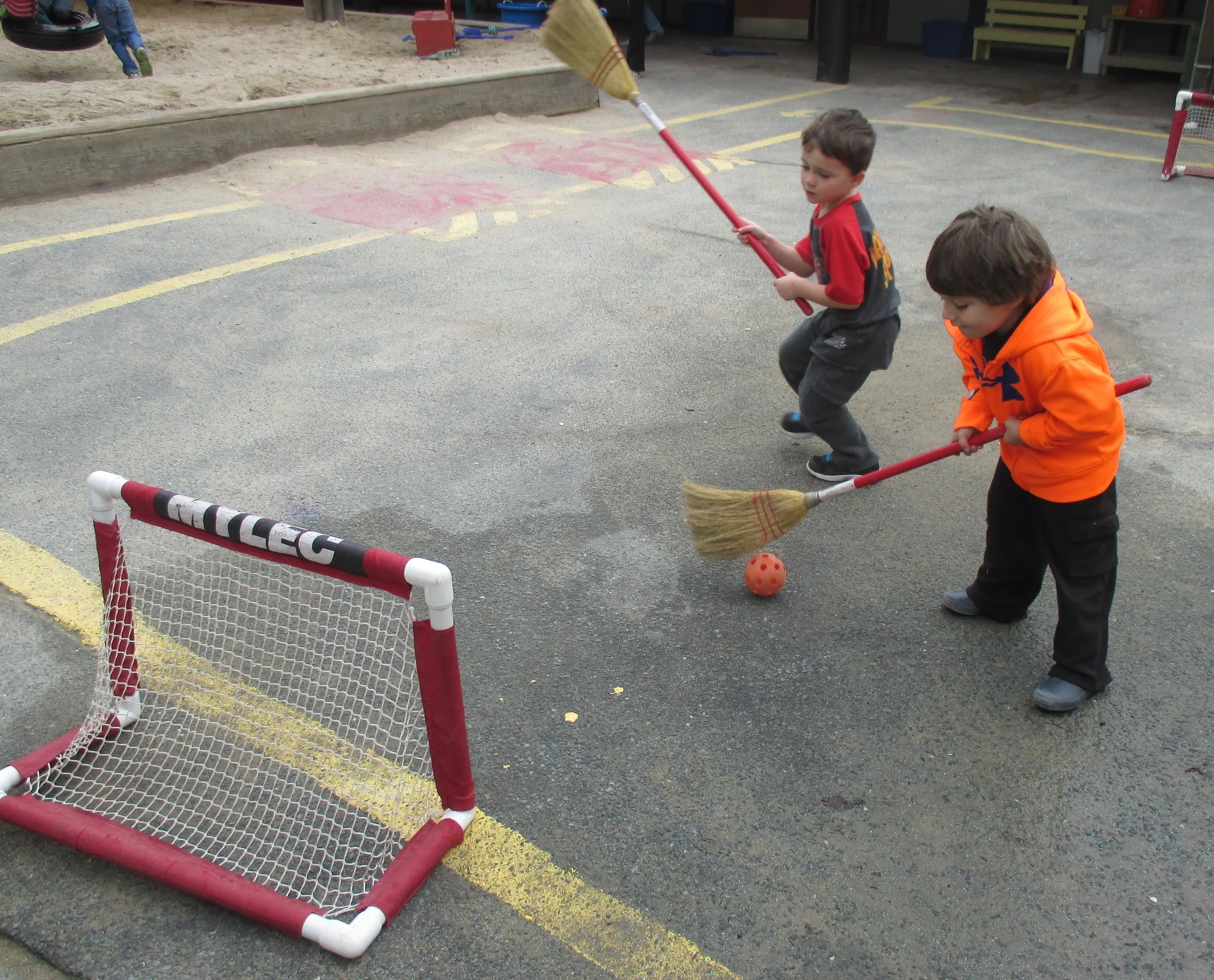 enjoying a friendly game of broomball