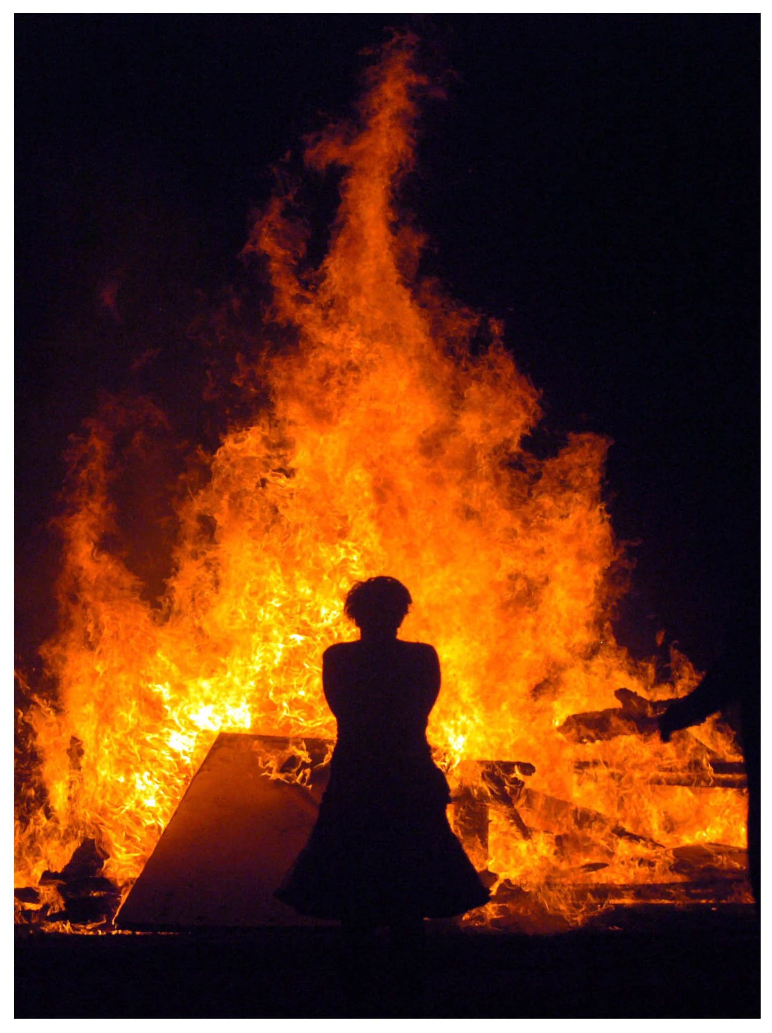 The Temple of Light, an art installation and memorial created by the Seattle Memorial Temple Project to honor 6 shooting victims last March, is set on fire Sunday September 3rd, 2006. (photo by Ron Lewis)