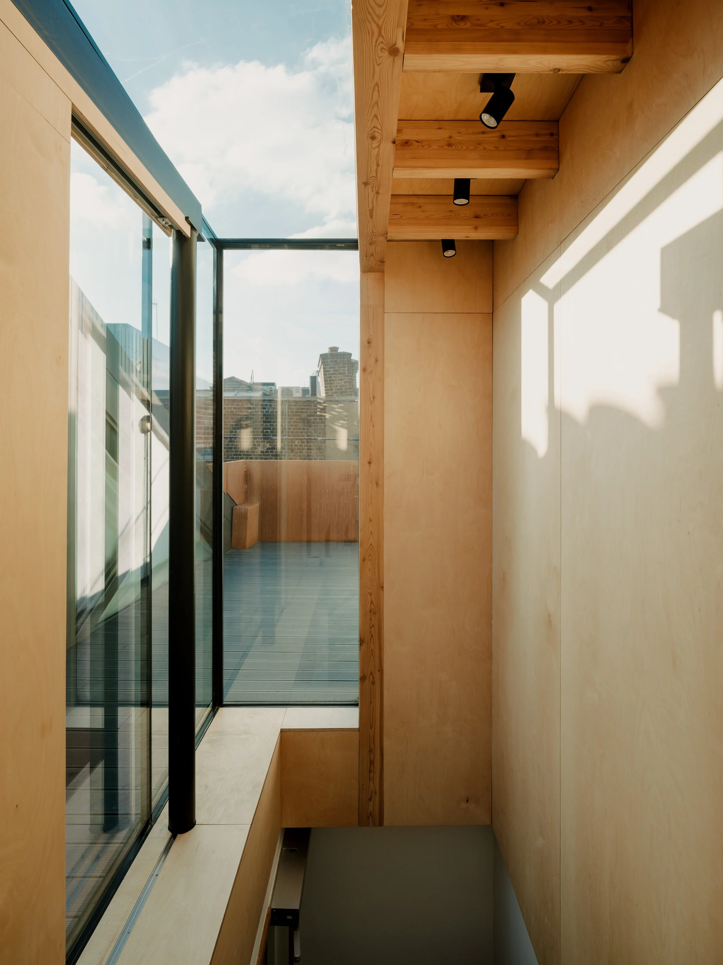  An innovative, sustainable and sculptural design for a stair enclosure. This development of an existing residence in a Victorian warehouse incorporated the complete remodelling of the roof terrace, installing an exposed larch glulam structural frame