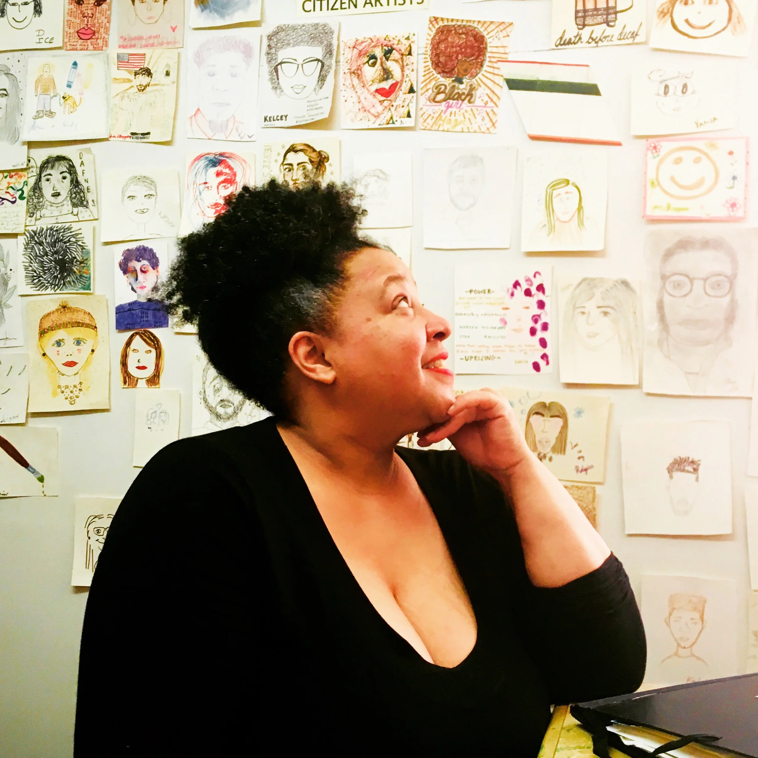 Karen in her studio inside The People’s Perk surrounded by customer self portraits.