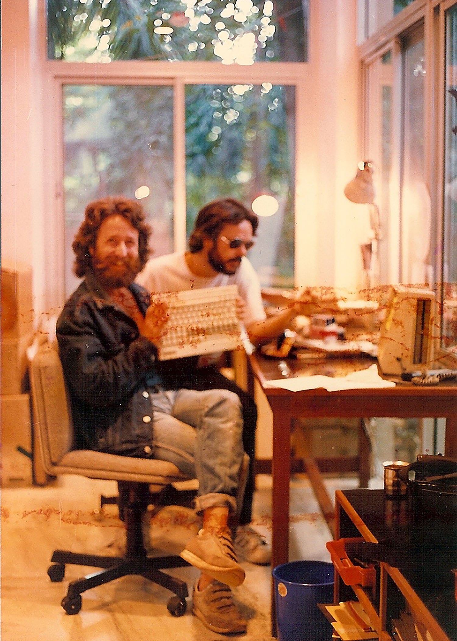 A photo from the Akashic archives that just made it thru many storms.... The Author with mentor Vimal, Master English humorist who speaks Japanese and Father, now. Notice how I am holding the keyboard, dissected from our computer, smiling like I didn’t just break it. Typing? Me? But then, Vim just got the punch-line, so, we’re good.