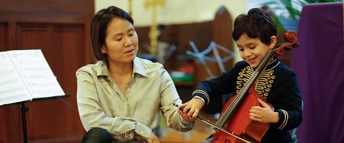 choi teaching cello lesson.jpg