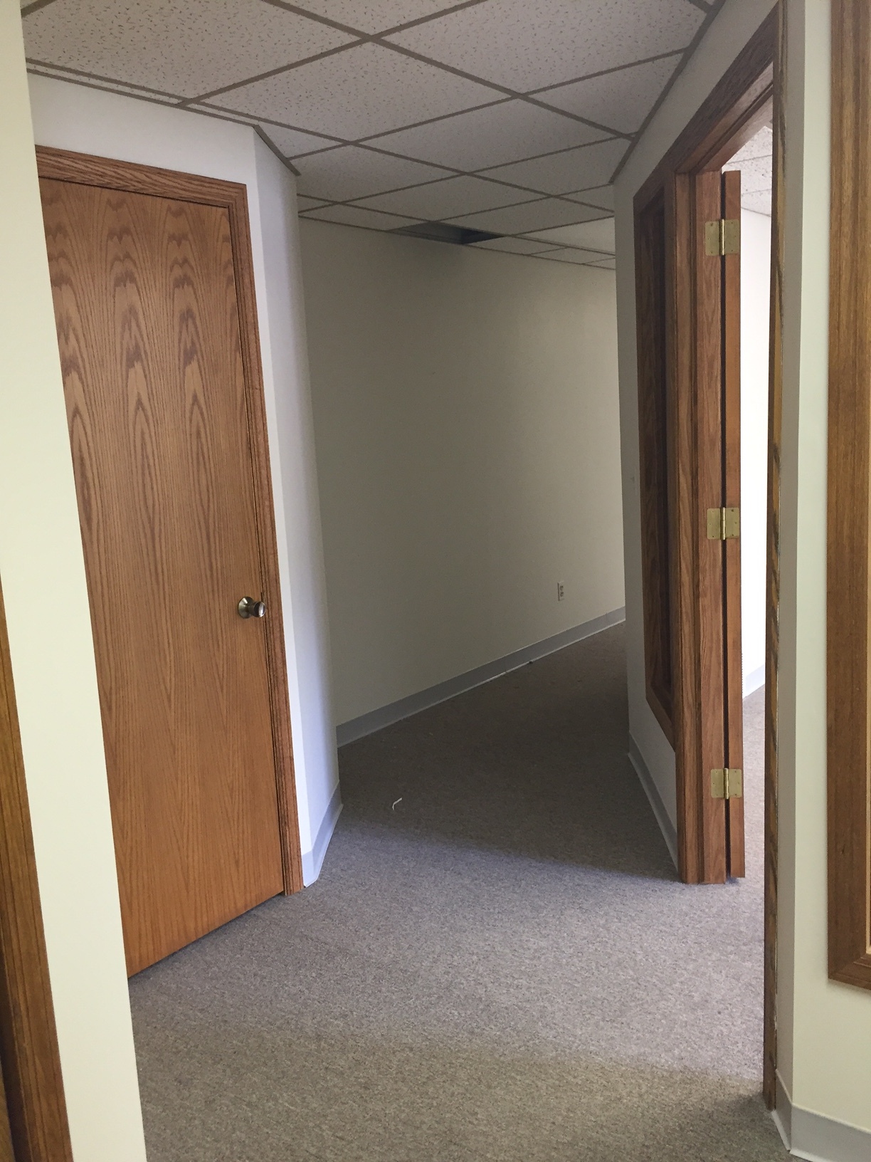 Before we added a door to this end of the hallway. Door into conference room on the right. 