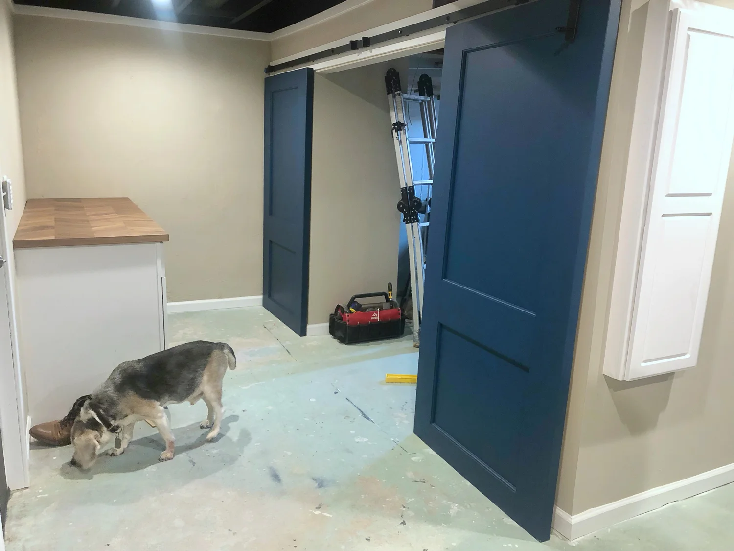 See? Shoe closet and coat closet be gone with you! Oh - and that little white cabinet on the right? That’s a built-in ironing board!