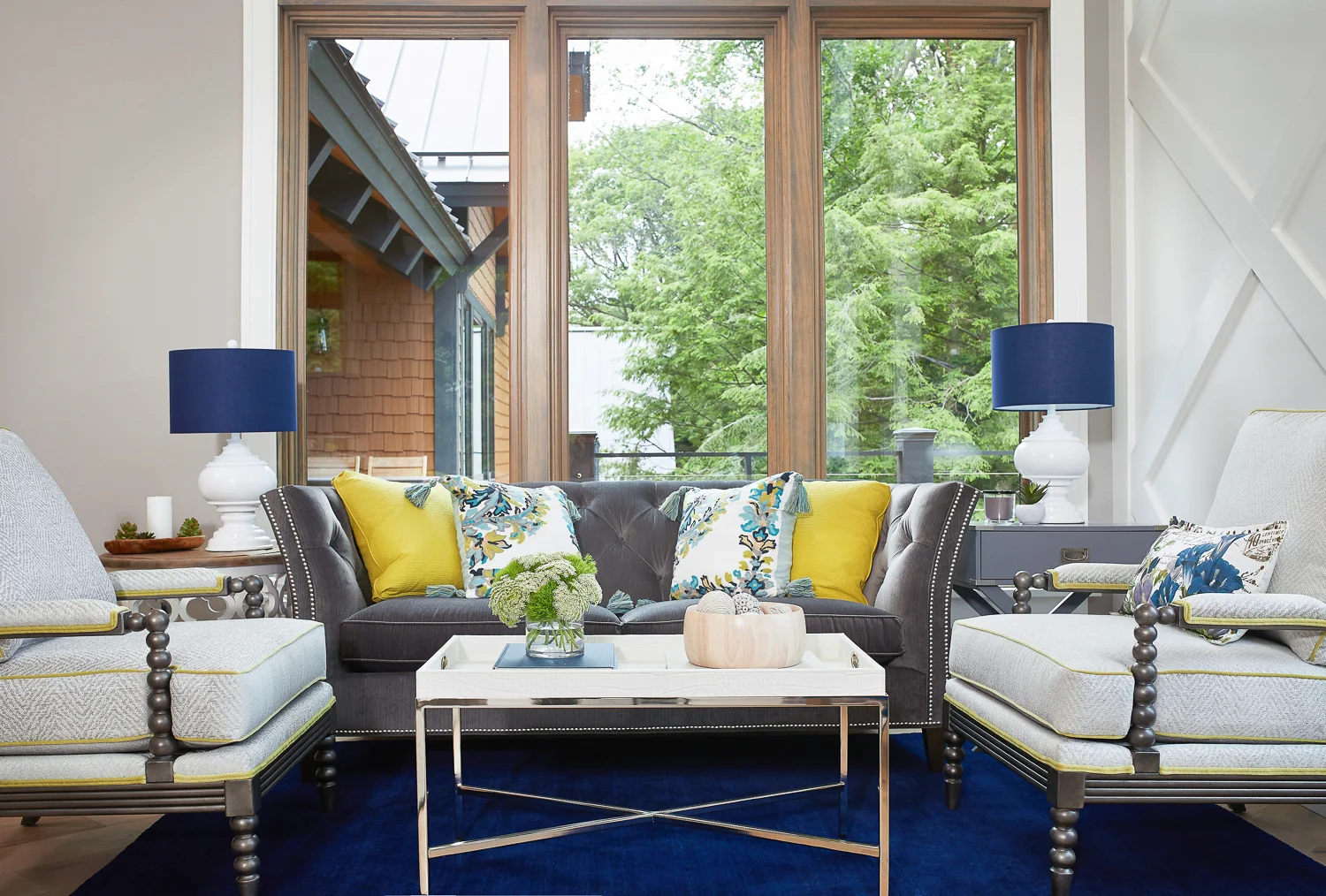The strip of wall on the left is La Paloma Gray. You can see how the warm undertones pair perfectly with the warm stain on the window mullions.