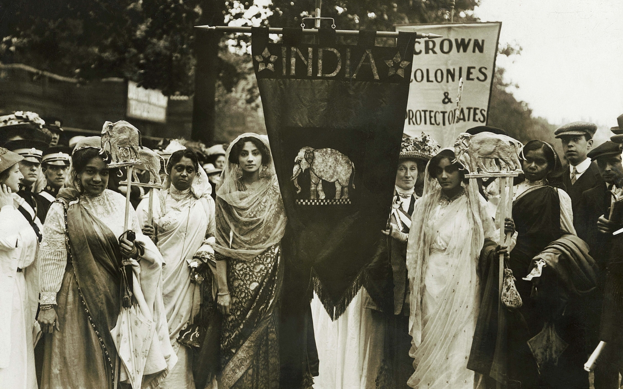 (c) Museum of London. Image shows Indian woman participating in an English Suffragette event.