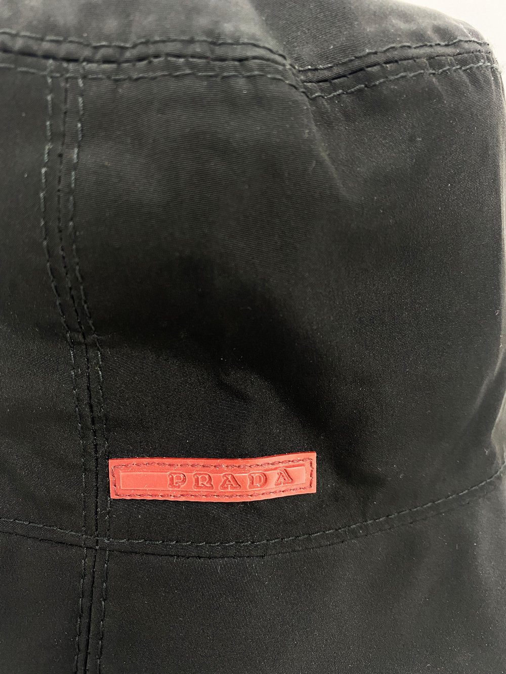 Prada Sport black bucket hat — JAMES VELORIA