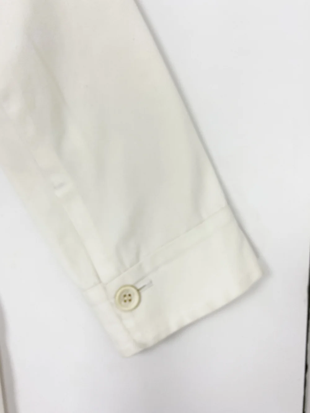 Yohji Yamamoto white asymmetrical trench coat — JAMES VELORIA