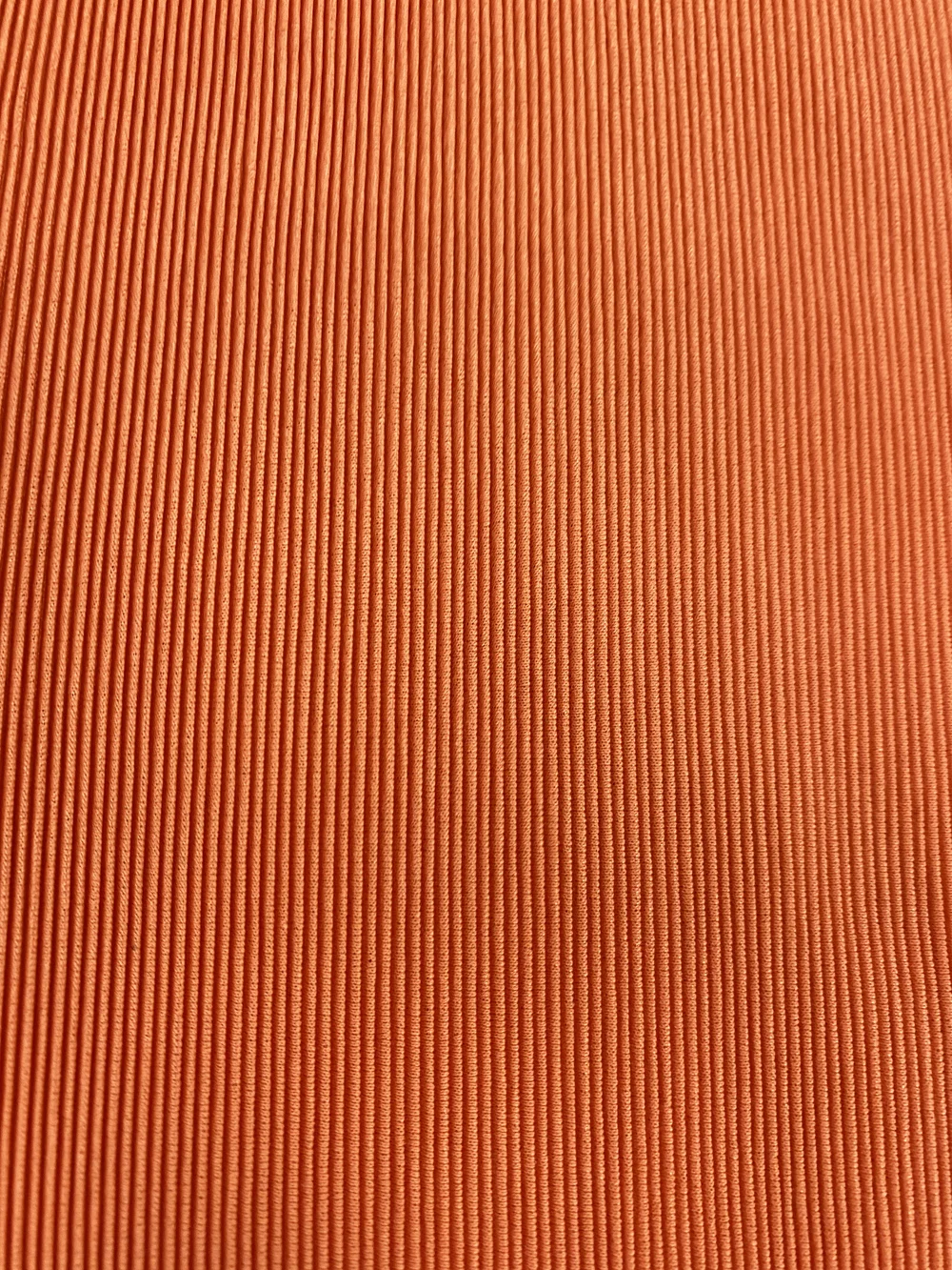 Pleats Please orange pleated top — JAMES VELORIA