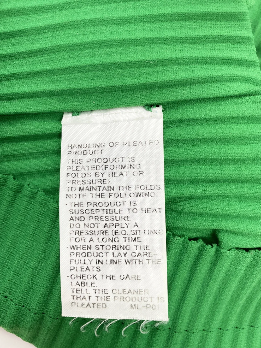 Issey Miyake APOC pleated green top — JAMES VELORIA