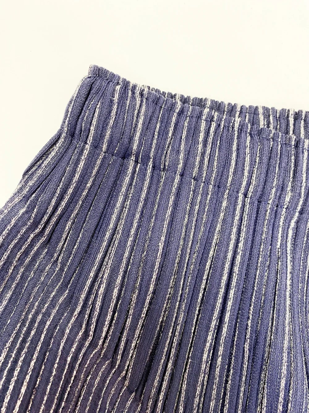 Pleats Please navy blue pleated pants — JAMES VELORIA