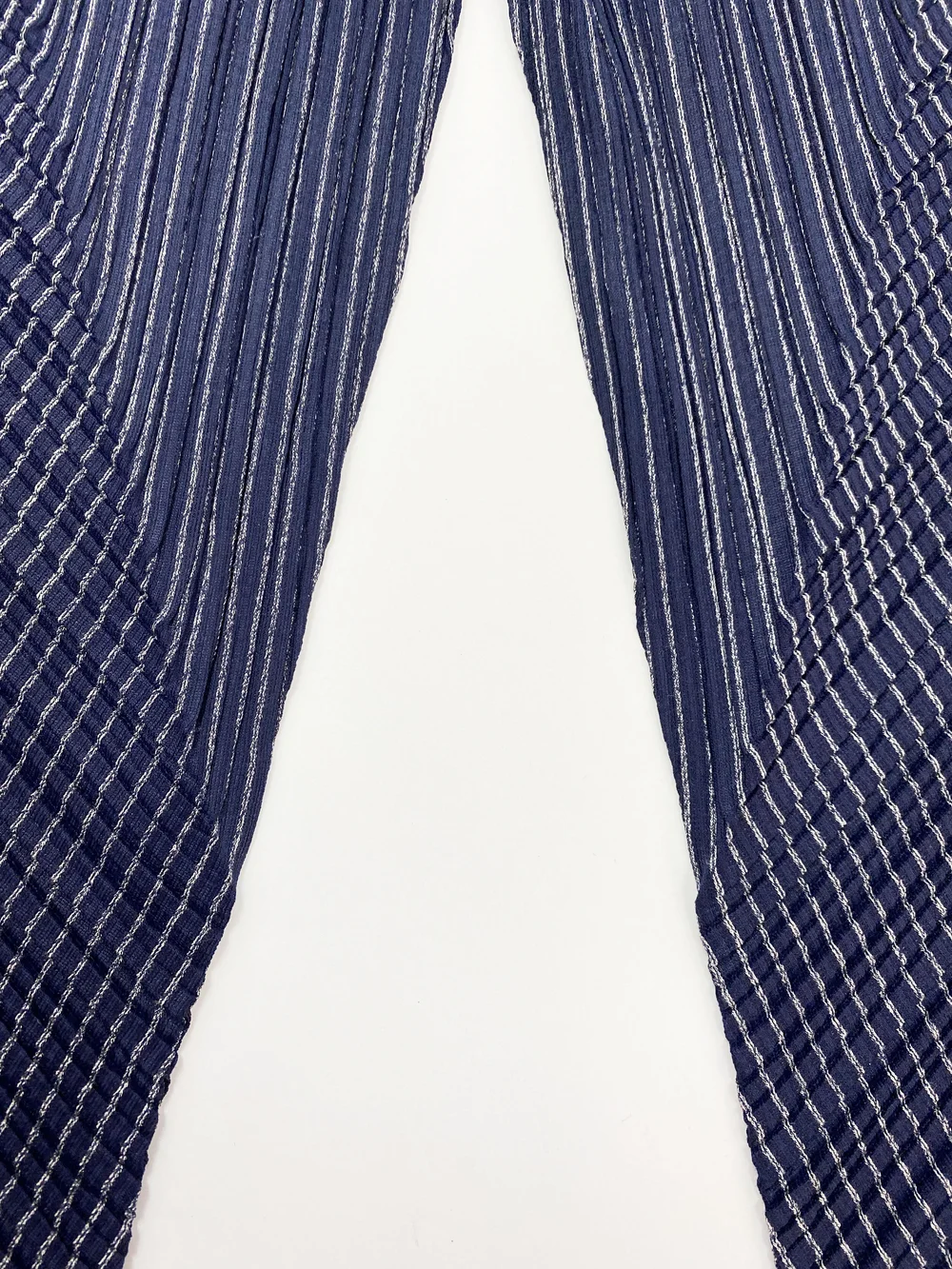 Pleats Please navy blue pleated pants — JAMES VELORIA