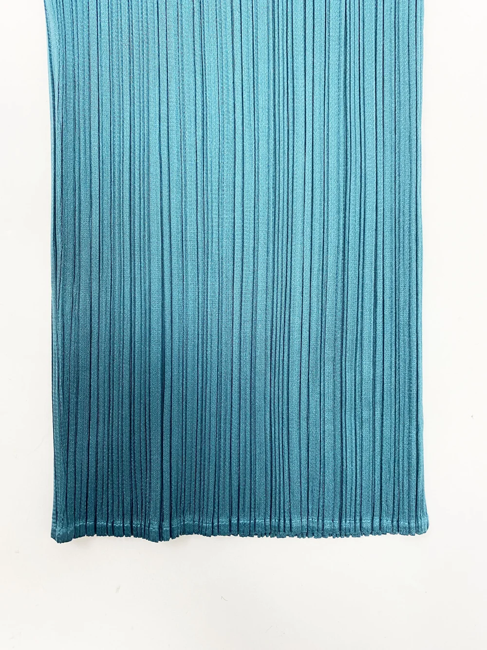 Pleats Please teal cropped pleated pants — JAMES VELORIA