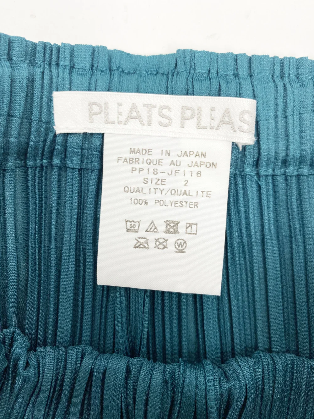 Pleats Please teal cropped pleated pants — JAMES VELORIA