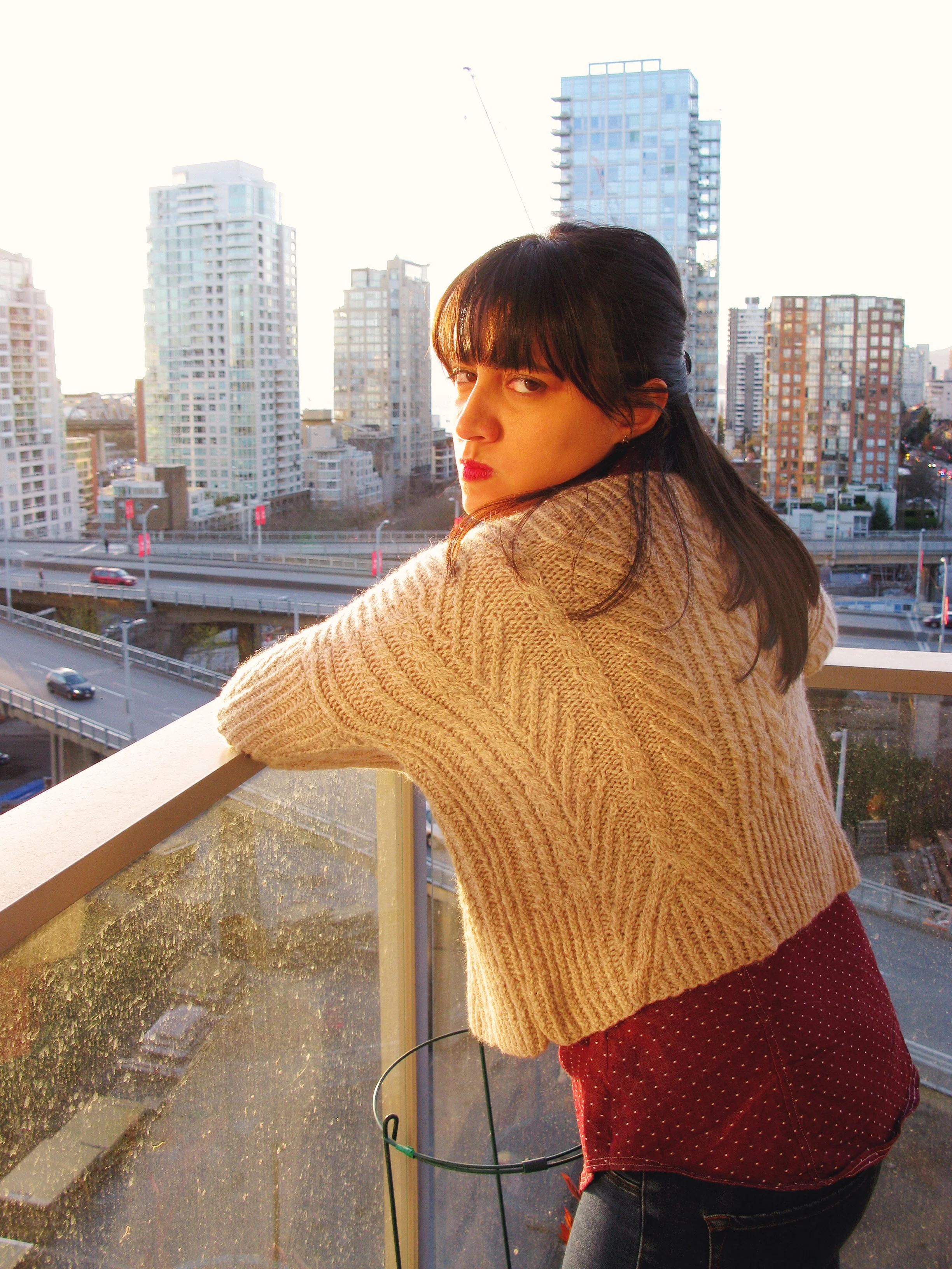 I love this picture! This is what happens when your 'photographer' (aka the fluffy blonde monster) tells you to do a 'hair flip' no hair-flips here my friend! I just had to include this photo because of the cut eye! Also because it gives a good shot of the side of the sweater.