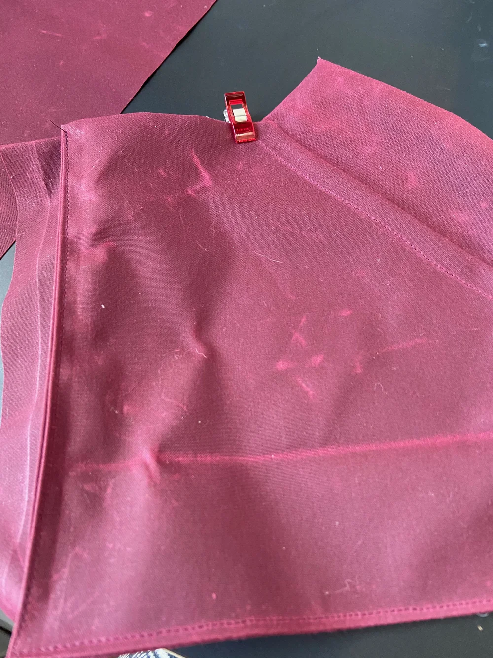  modified pocket topstitched to unmodified on the two longest sides  