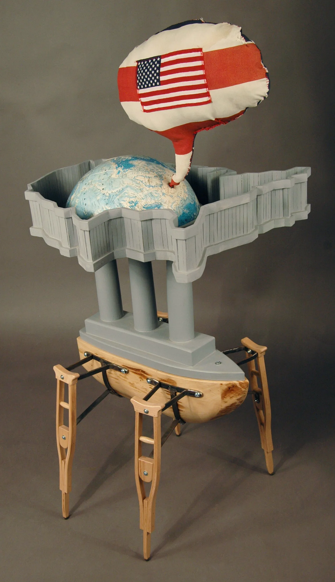 2. Title: American Dreamboat Media: Wood, steel, paint, fabric, poly-fill, and vintage globe Dimensions: 44"h x 35"w x 29"d