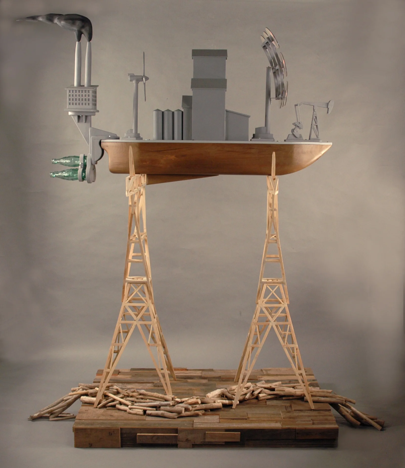 14. Title: Seeking Higher Ground Media: Wood, paint, compact discs, glass bottles, and steel Dimensions: 88"h x 92"w x 38"d
