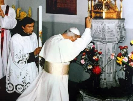 Pope Saint John Paul II at his baptismal font image via @ChurchinPoland