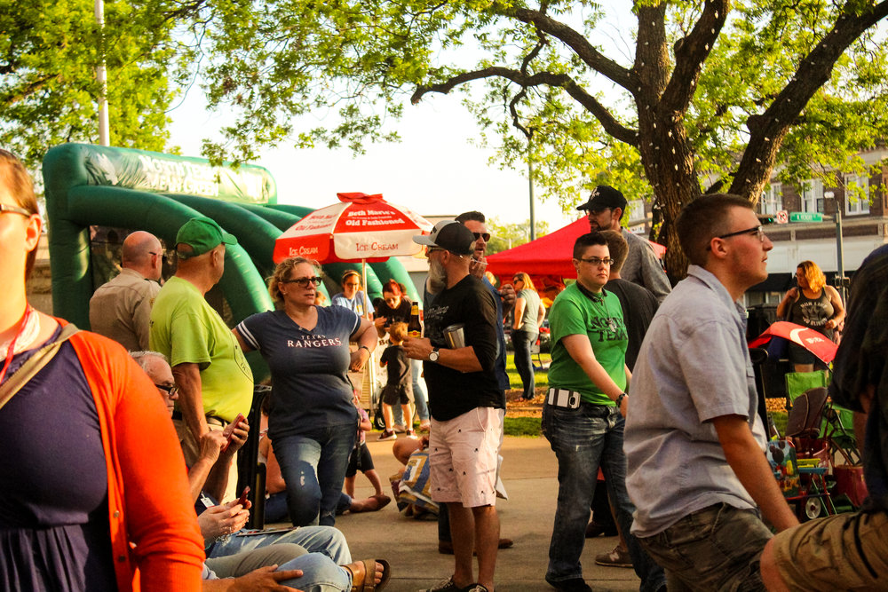 people hanging out at an outdoor event