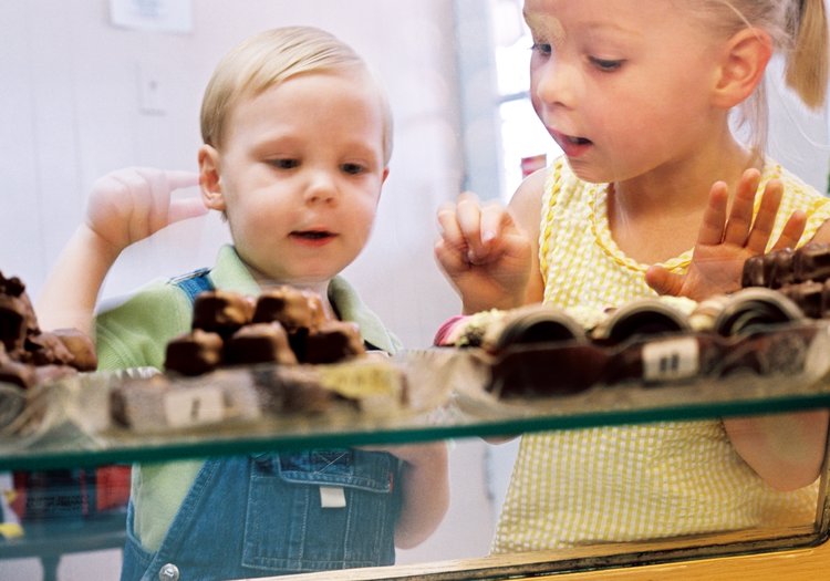 two children looking at candy