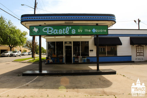 a picture of the outside of a car shop converted into a store.jpg