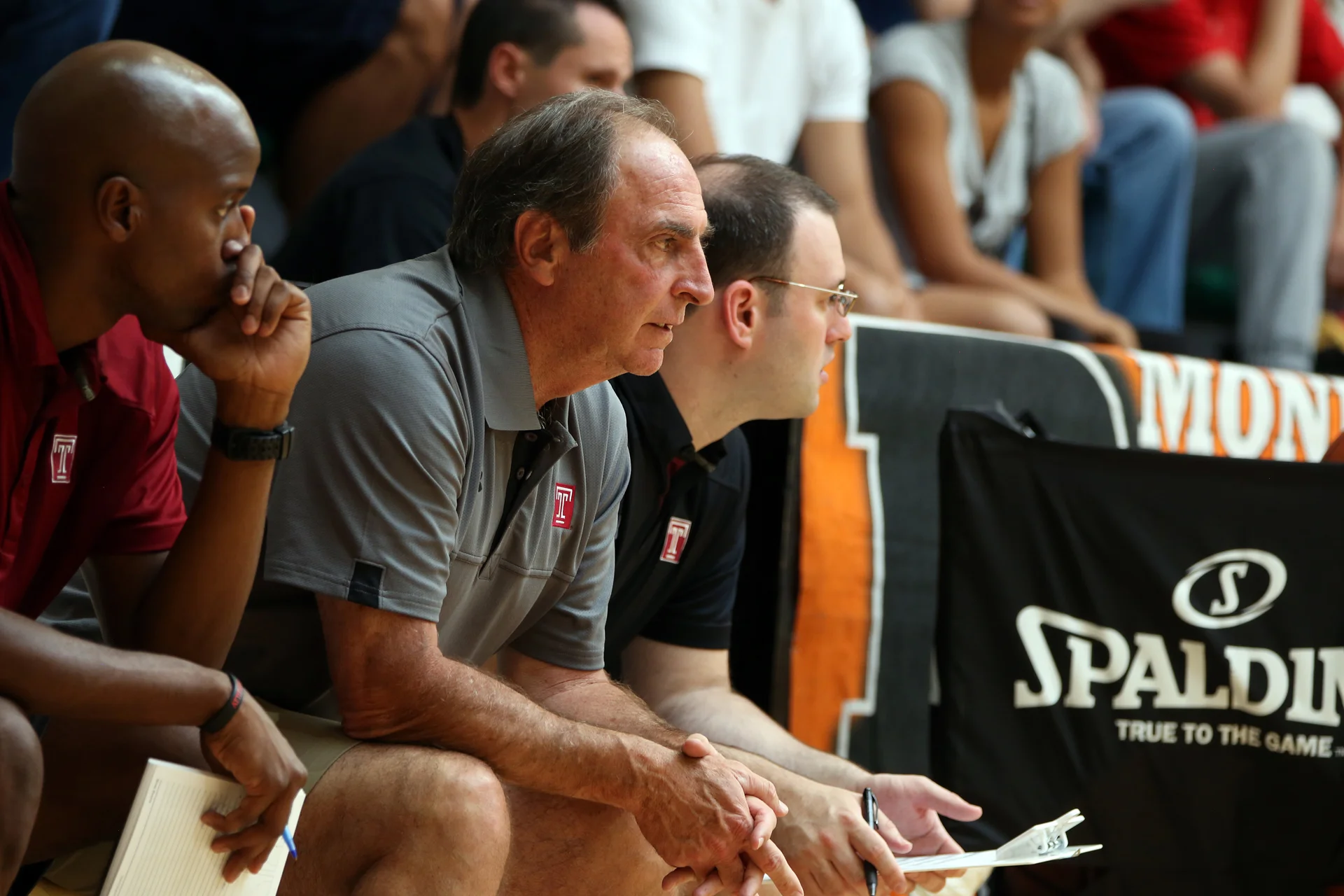 Coach’s watchful eyes overlook the court.
