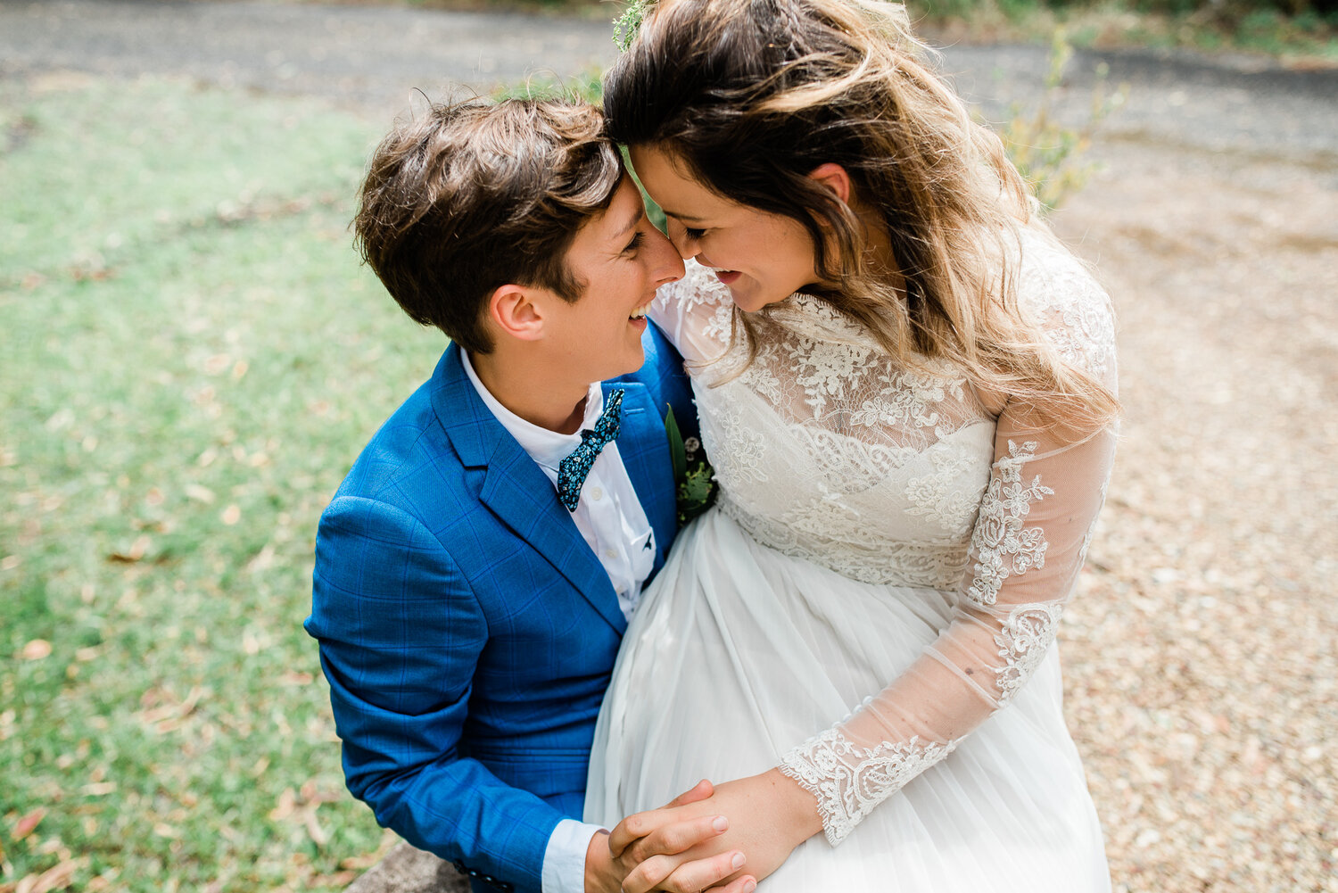 Lua and Mona, definitely going with my advice to take a seat and chill for a minute, during their wedding on the Sunshine Coast.