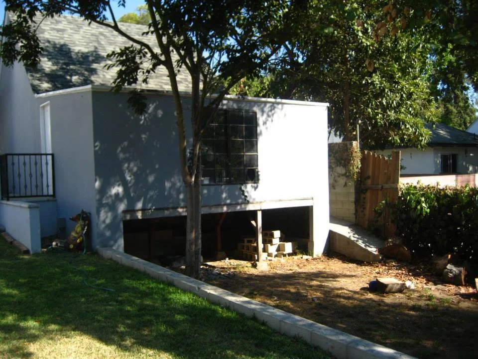 "Before" image of the future cabana and raised wood deck.