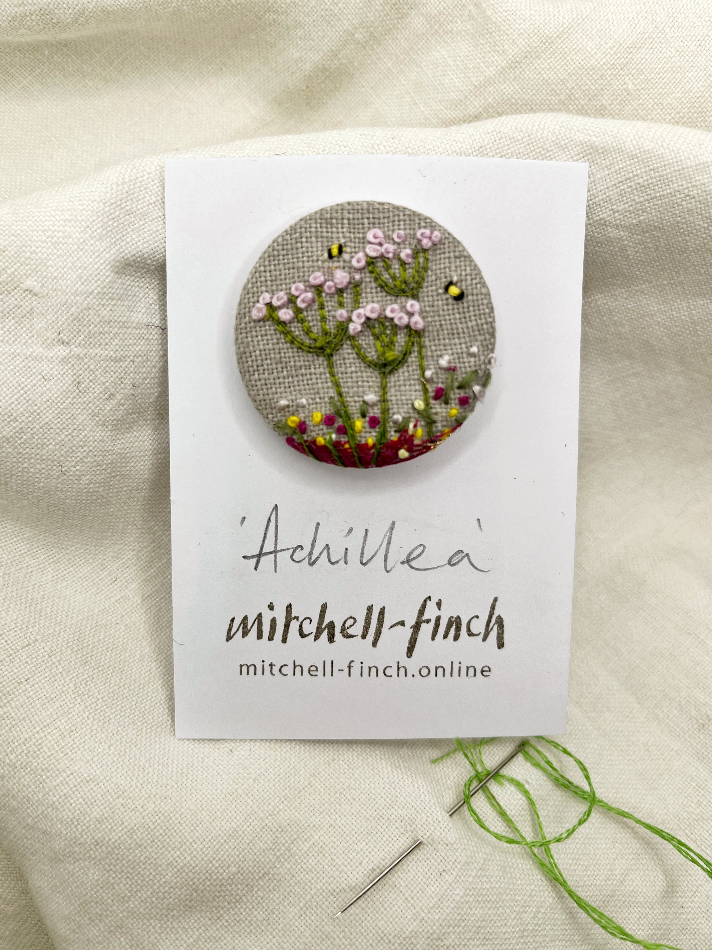 achillea button brooch