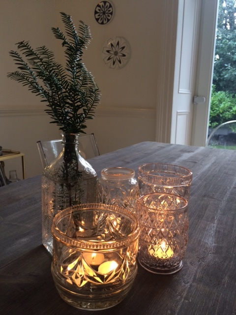 Vintage cut glass jars create pretty tea light holders for a party table