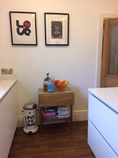 This is the dividing wall between the hall and the kitchen that I wanted knocking out. Now it's a great place for pictures and I love that I can put a vintage trolley table with all my colourful and no-longer ornamental cook books there. This one was £5 from a charity shop.