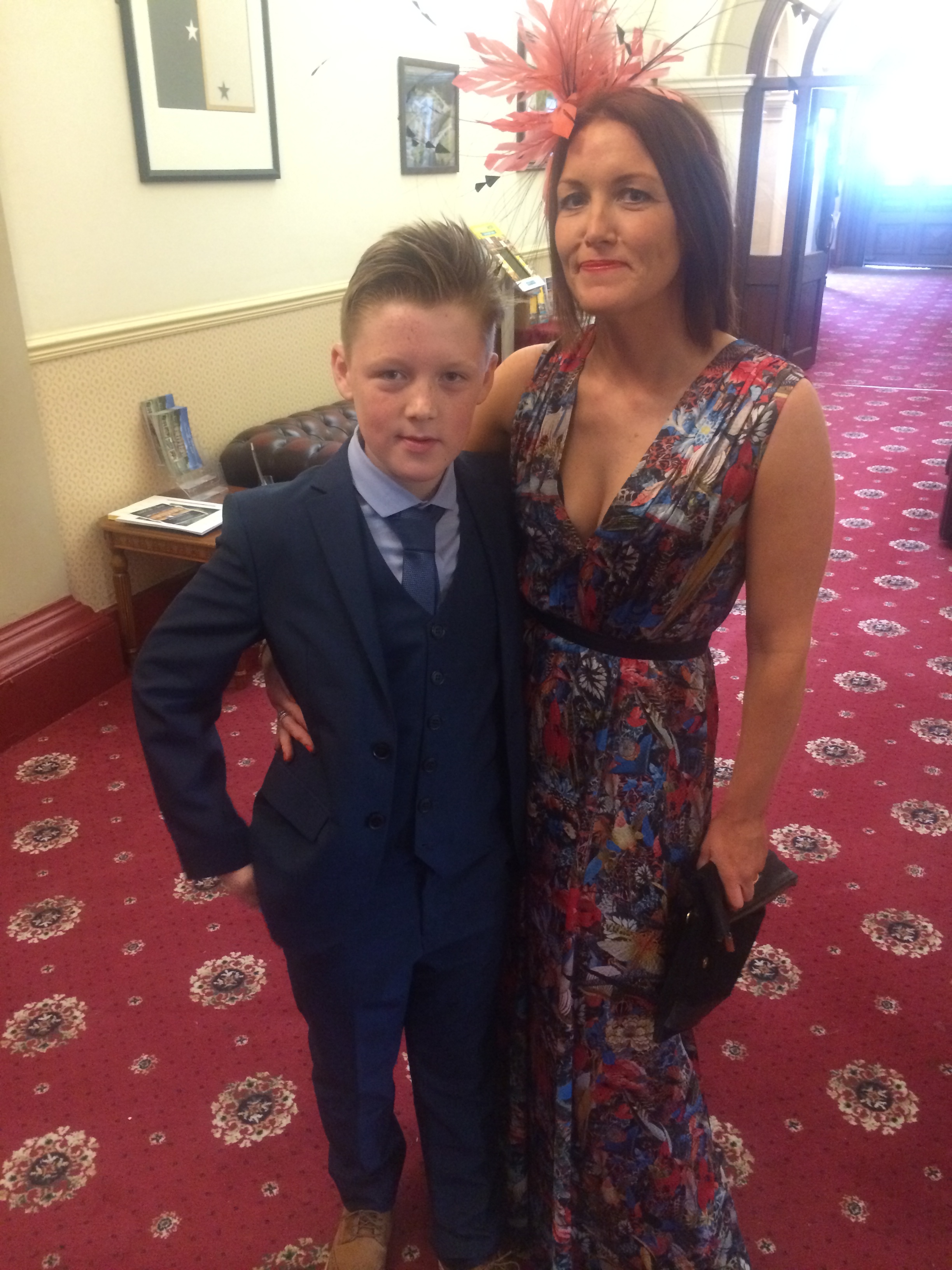 My eldest son George looking rather dapper and oh yes, that woman in the flowery frock and the fascinator? That'll be me!
