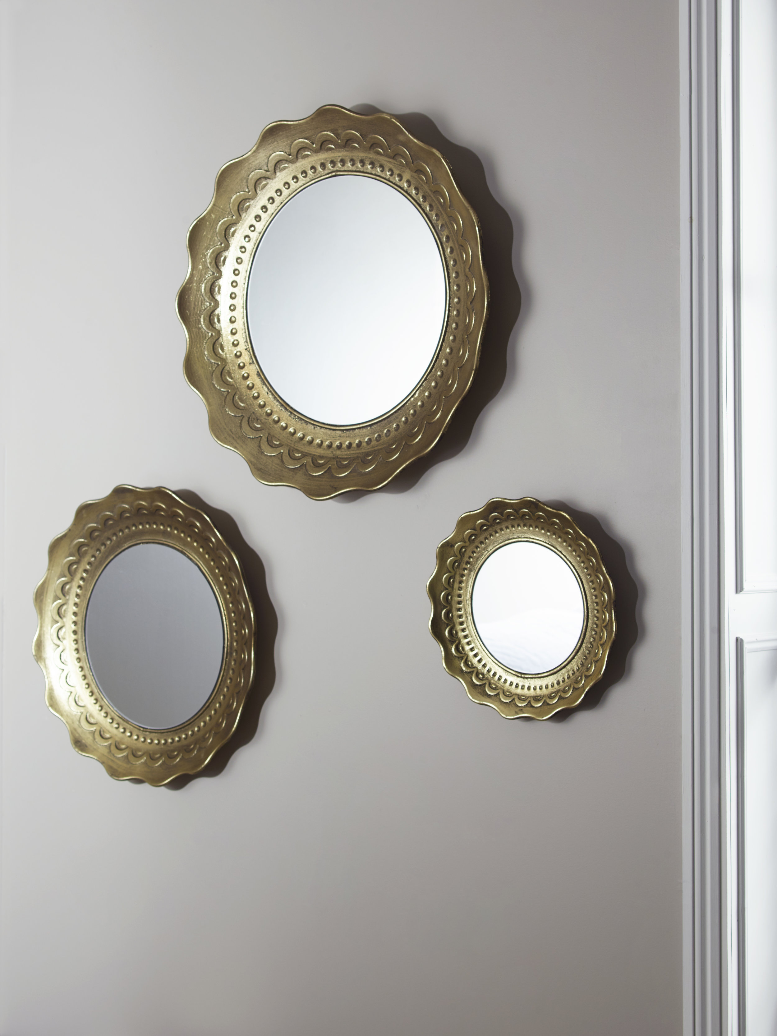 3 scollop edge mirror cluster £175 Cox and Cox