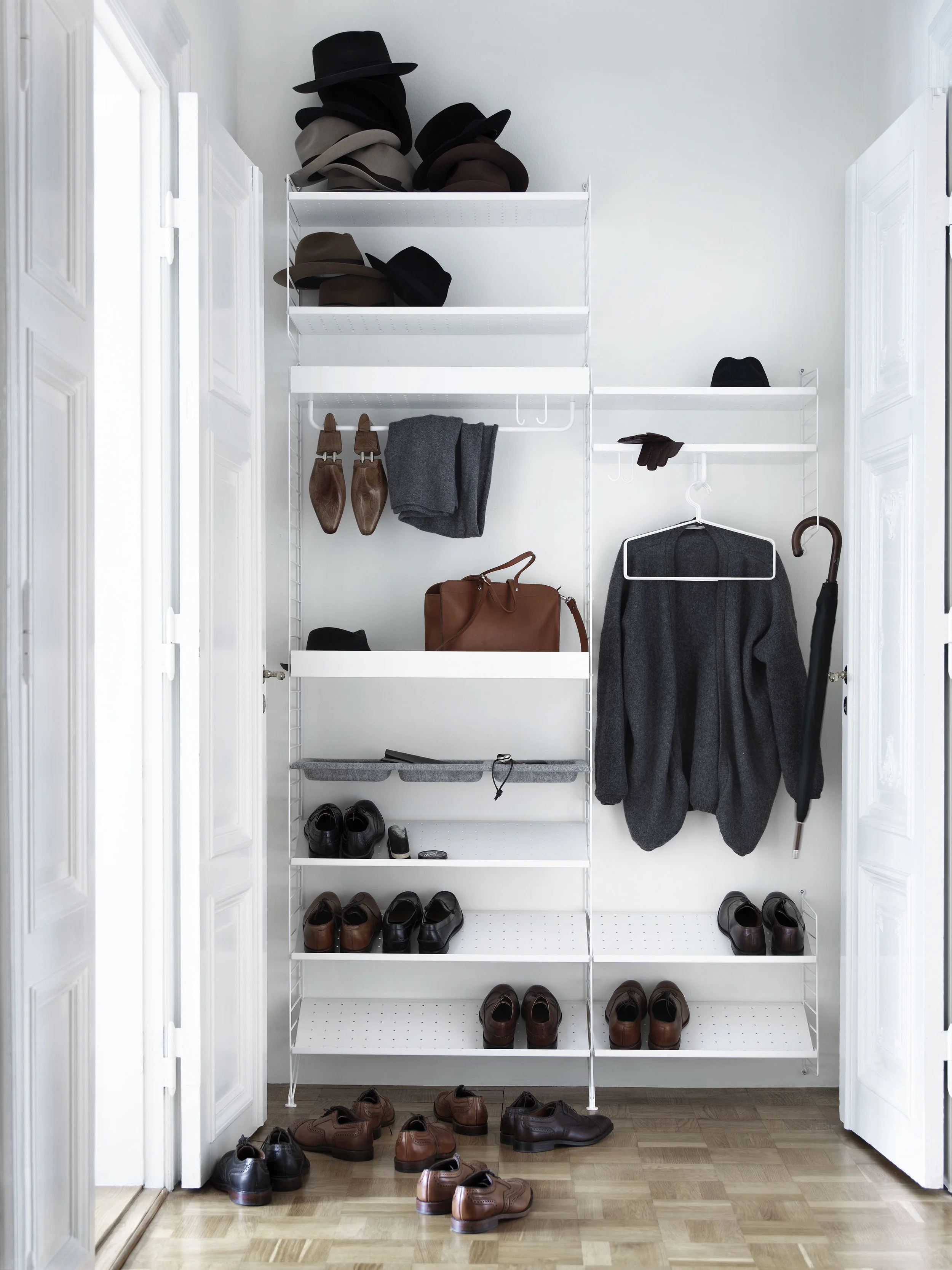 Metal string system in white with white wall panels from £52 www.skandium.com