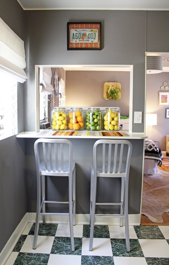This peak-a-boo counter keeps your dining options open, airy, and functional. Photo via Houzz.