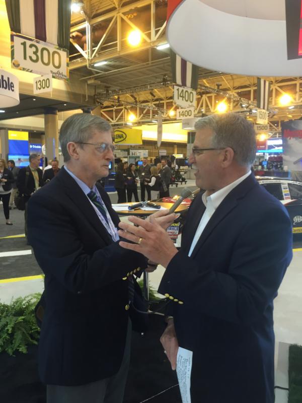 Don Molino visits with Keith Porter of Dow Agro Sciences