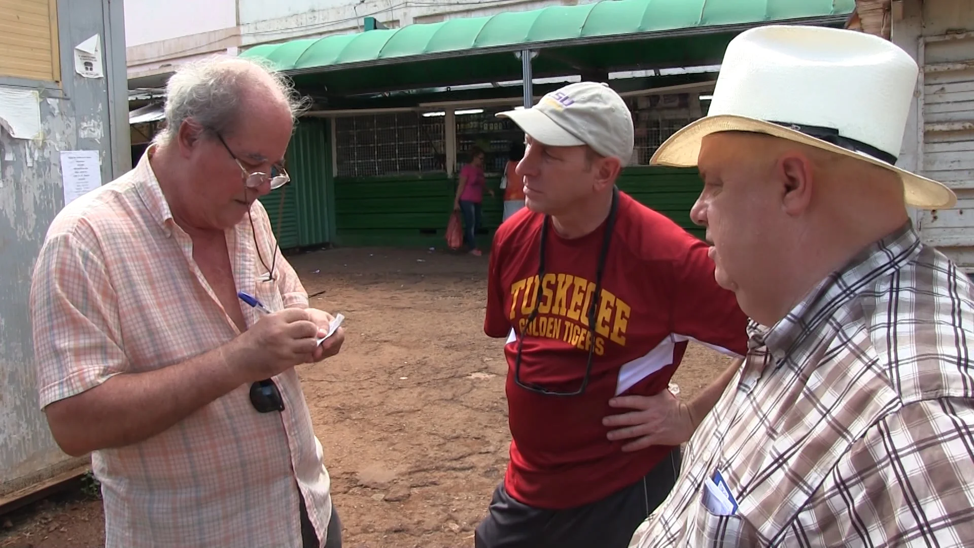 Perez visits with Rene Simon and Louisiana Commissioner of Agriculture & Forestry Dr. Mike Strain.