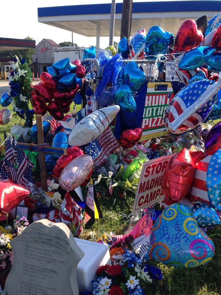 The memorial to two slain Baton Rouge police officers and an East Baton Rouge Sheriffs deputy sits less than a block from the Louisiana Farm Bureau Federation's office in Baton Rouge.