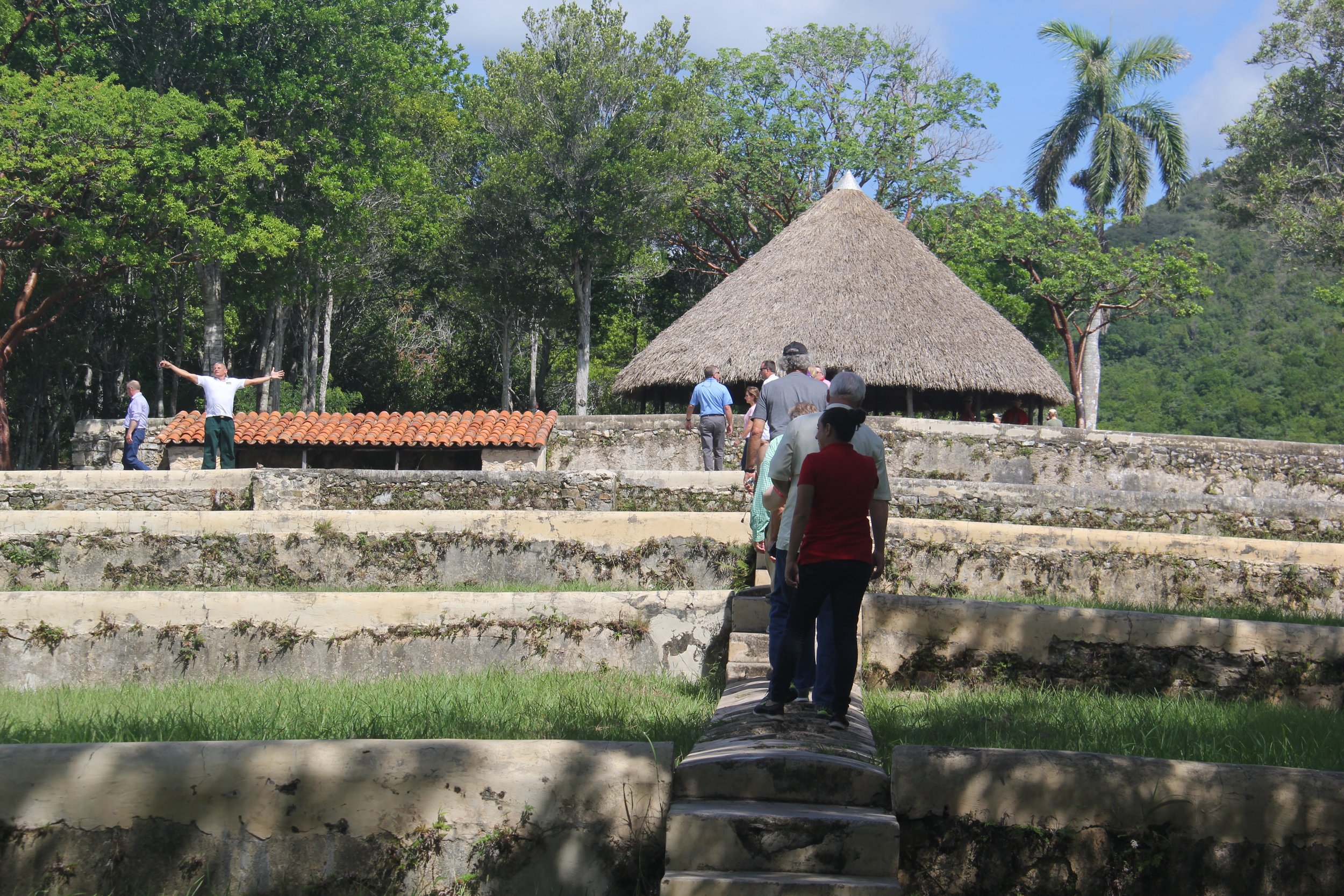 Our guide, Oriel, soaks up the mountain breeze in a dramatic gesture as the tour ascends to the grinding house. 