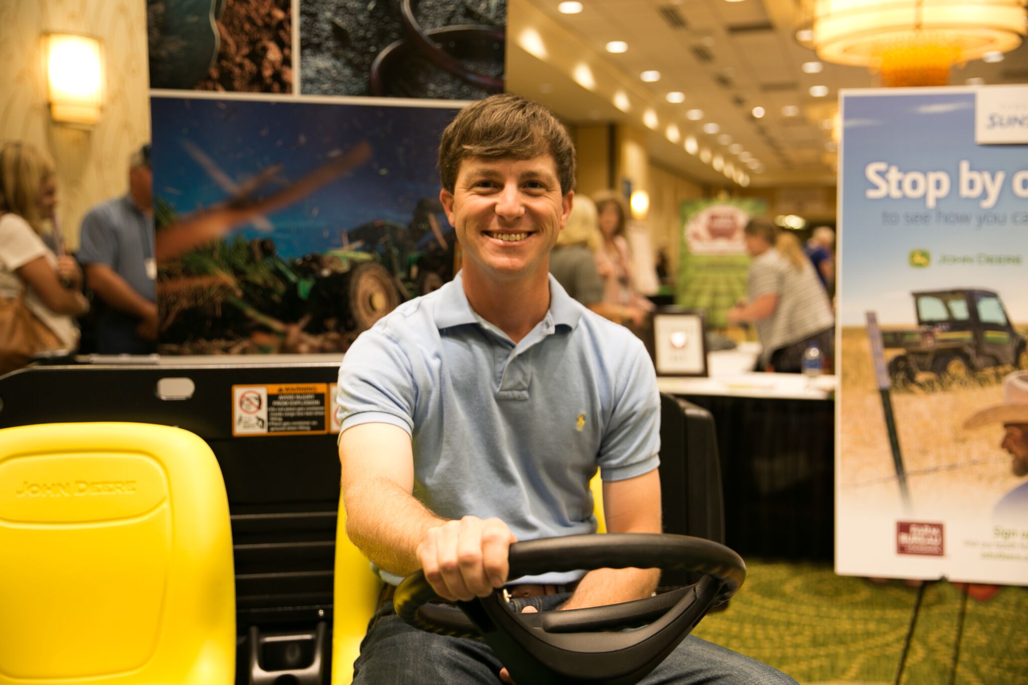 2018 Louisiana Farm Bureau Young Farmers and Ranchers Discussion Meet Winner Stephen Simoneaux sits on his new John Deere Gator.