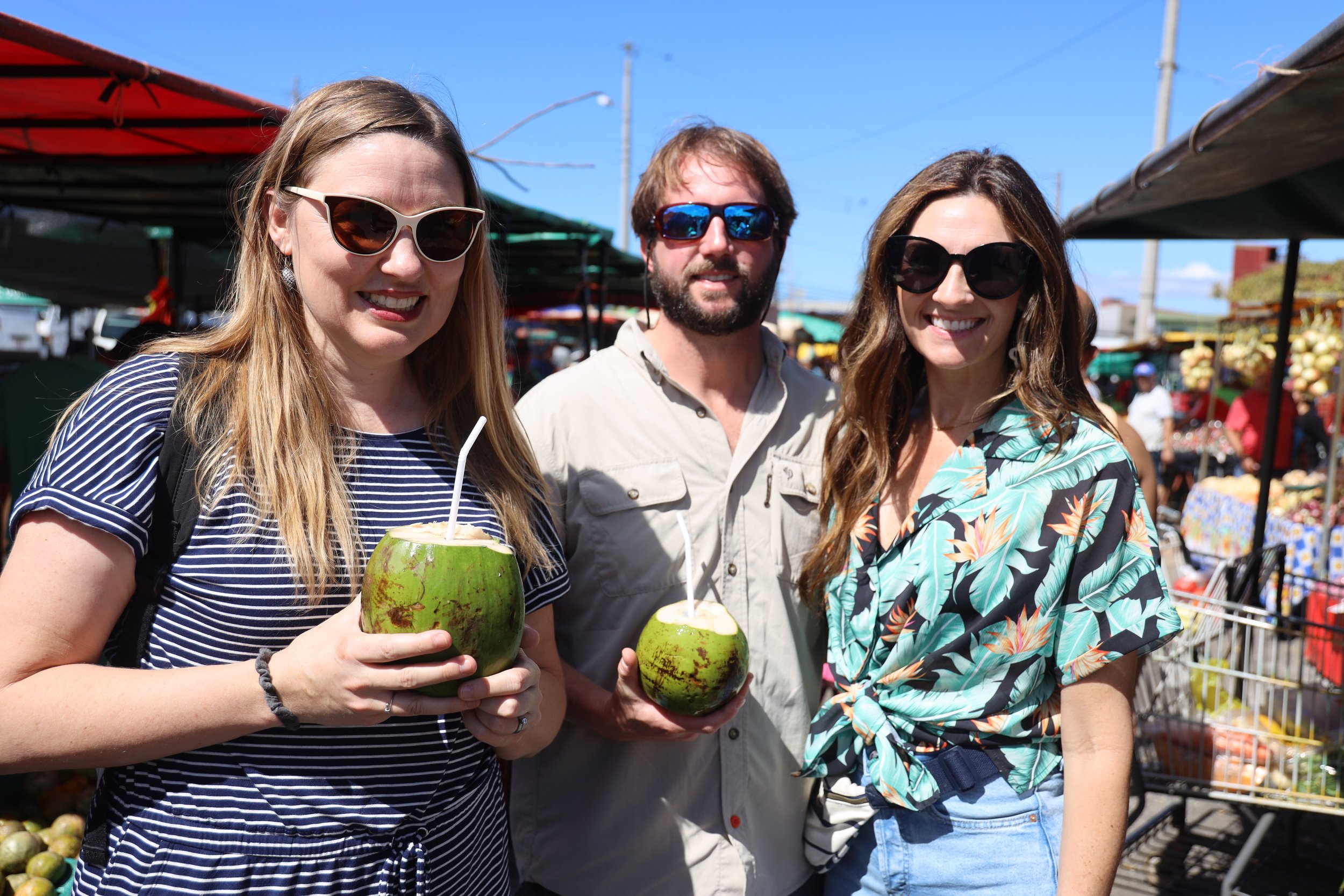  BREADA Director Darlene Rowland was particularly interested in seeing San Jose's farmer's market, as she runs the one in Baton Rouge.&nbsp; Here, she, Will Killen and his wife, Lindsey, enjoy coconut juice direct from the source, bought fresh here a