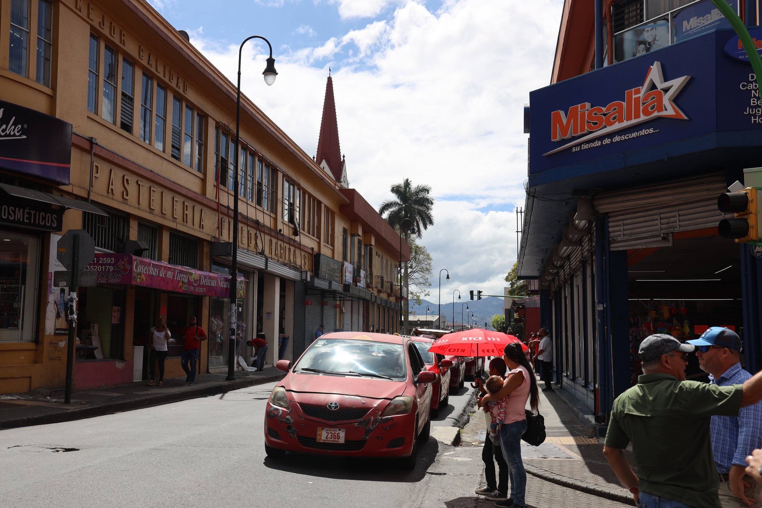  Downtown San Jose with mountains in the background.&nbsp; The city houses more than 1/3rd of the total population of Costa Rica, and sits in a valley between two of the country's three mountain ranges. 