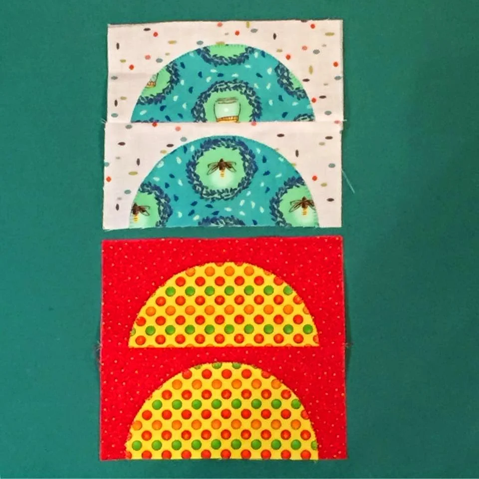 Charlotte Noll's bright blocks include some bees. 