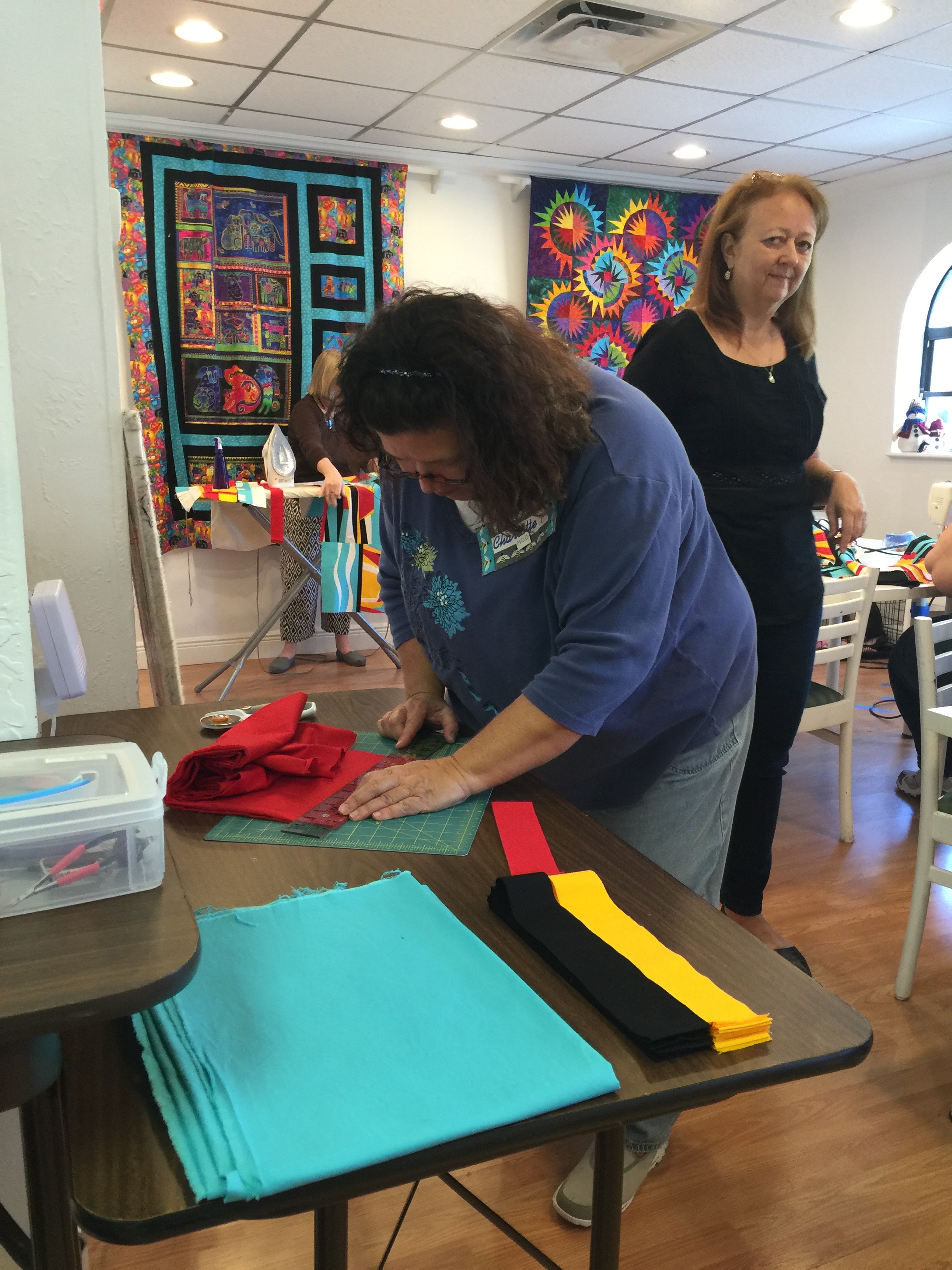 Charlotte and Debby work on binding