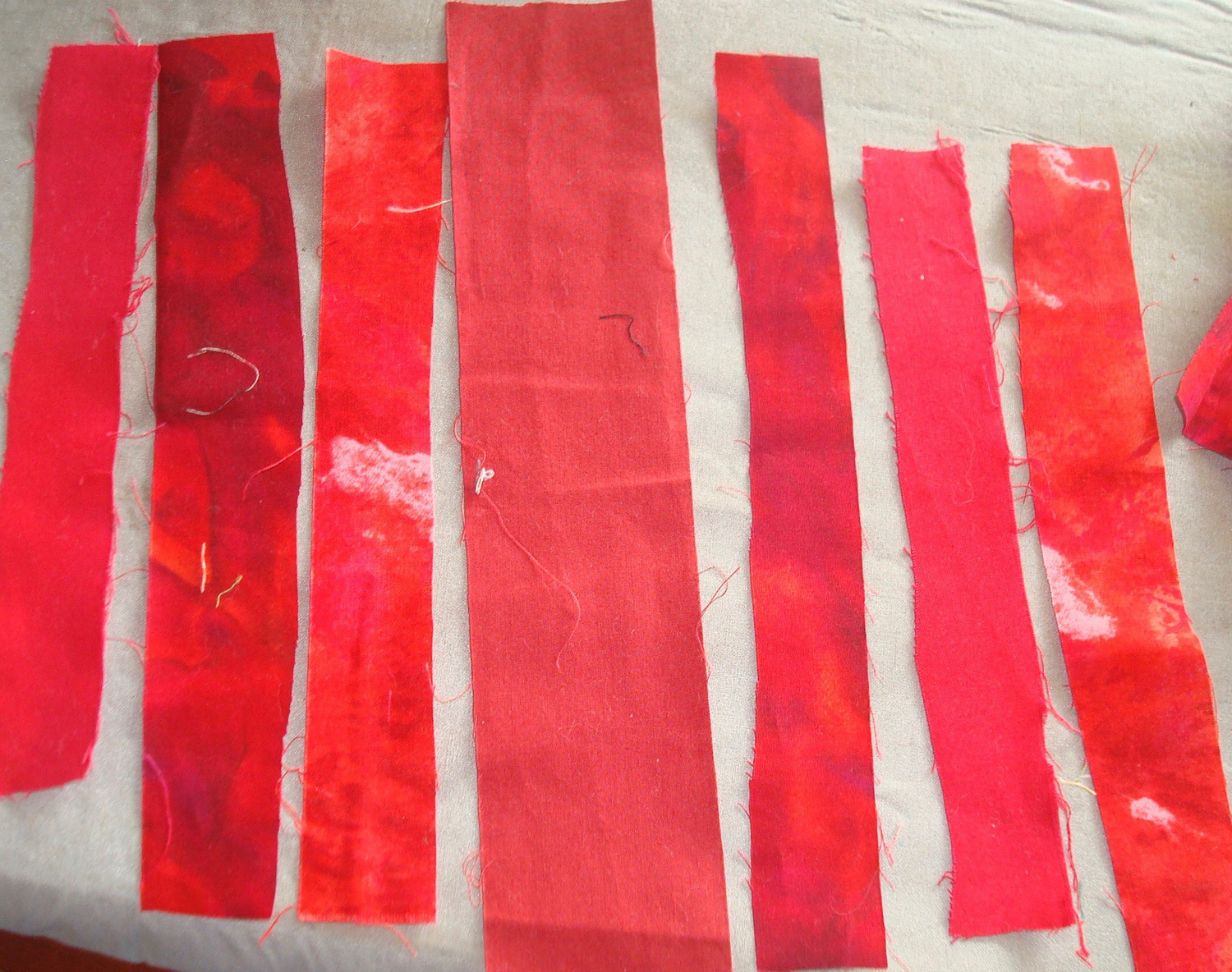 Free cut strips of various shades of one color.