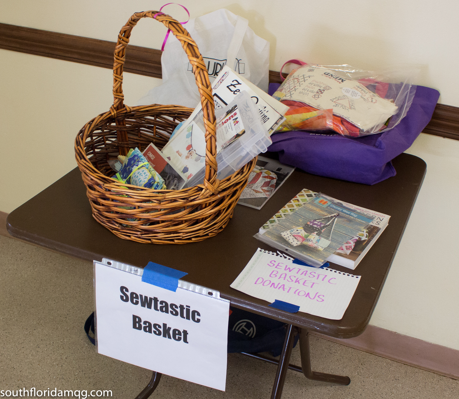 Gathering up donations for the Sewtastic Raffle basket fundraiser for June meeting