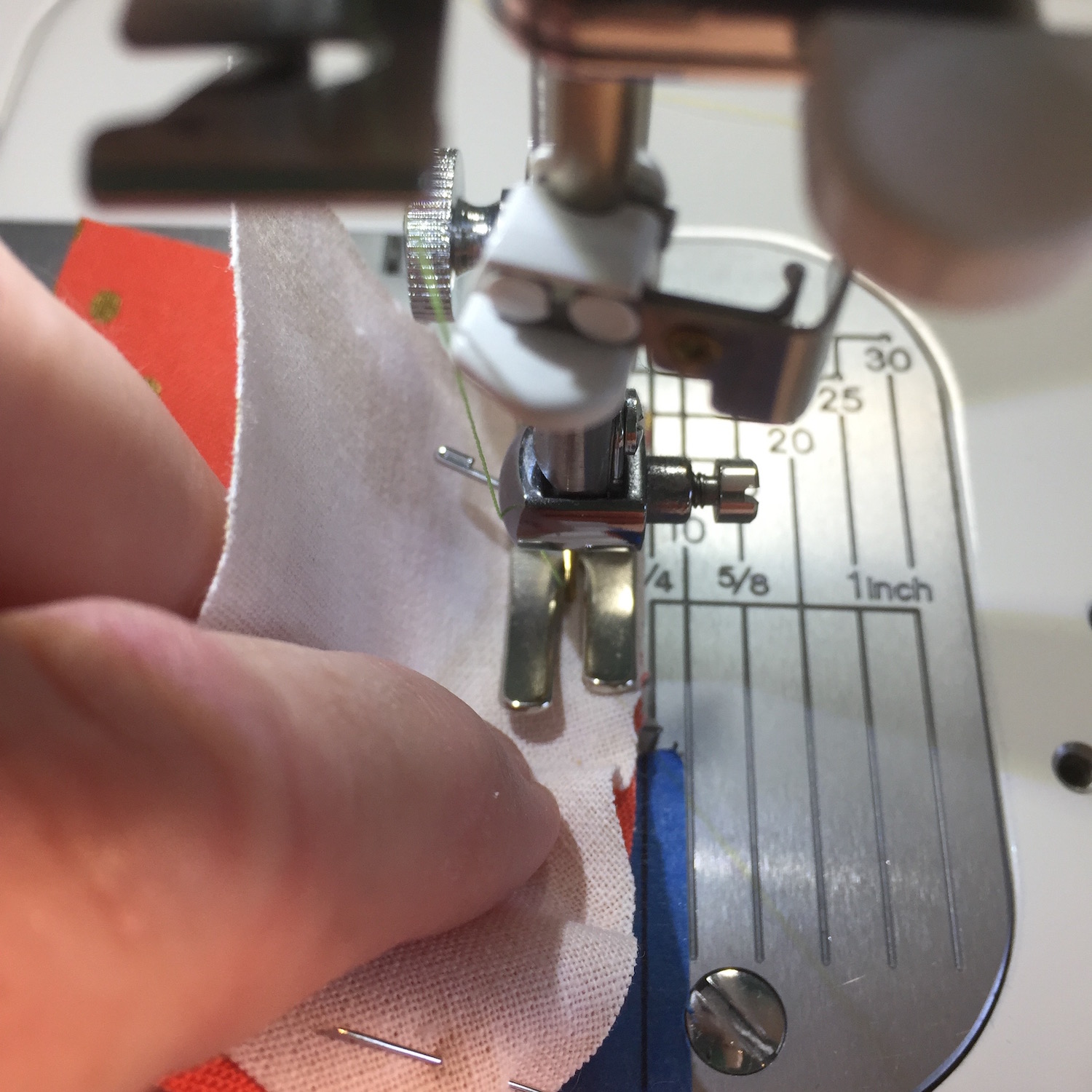 With the needle down you may have to lift the presser foot and adjust the fabric to keep it even and at ¼ inch