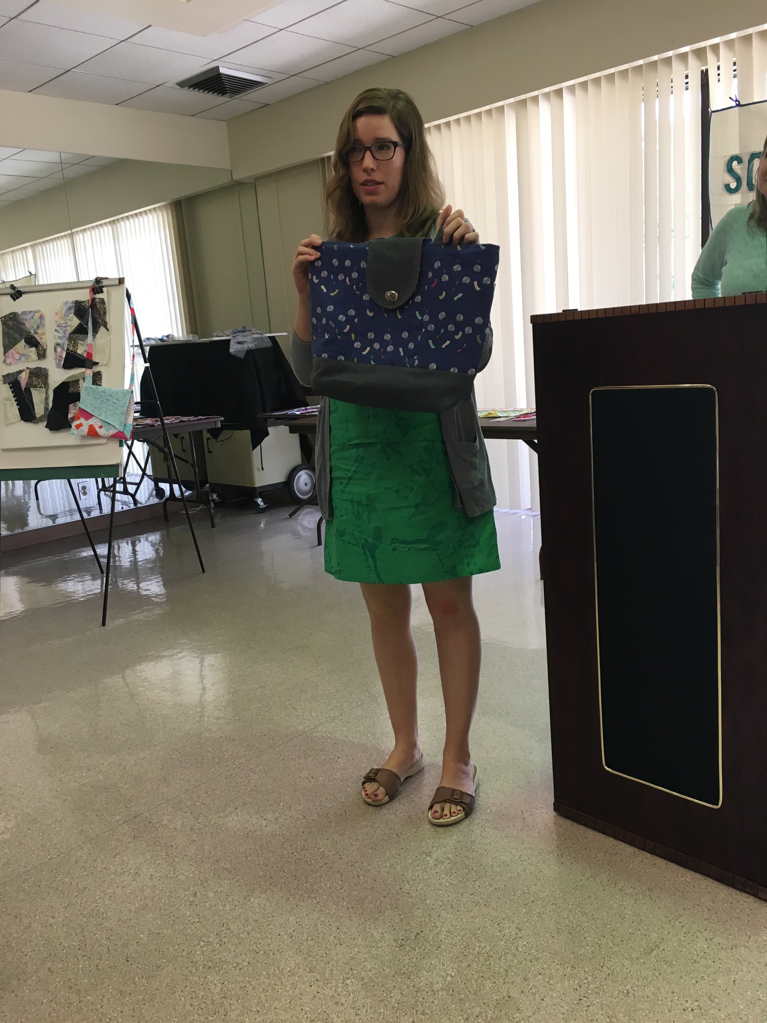  Kate with a finished sample of the bag for this weekends bag workshop. Also, wearing a dress she made! 